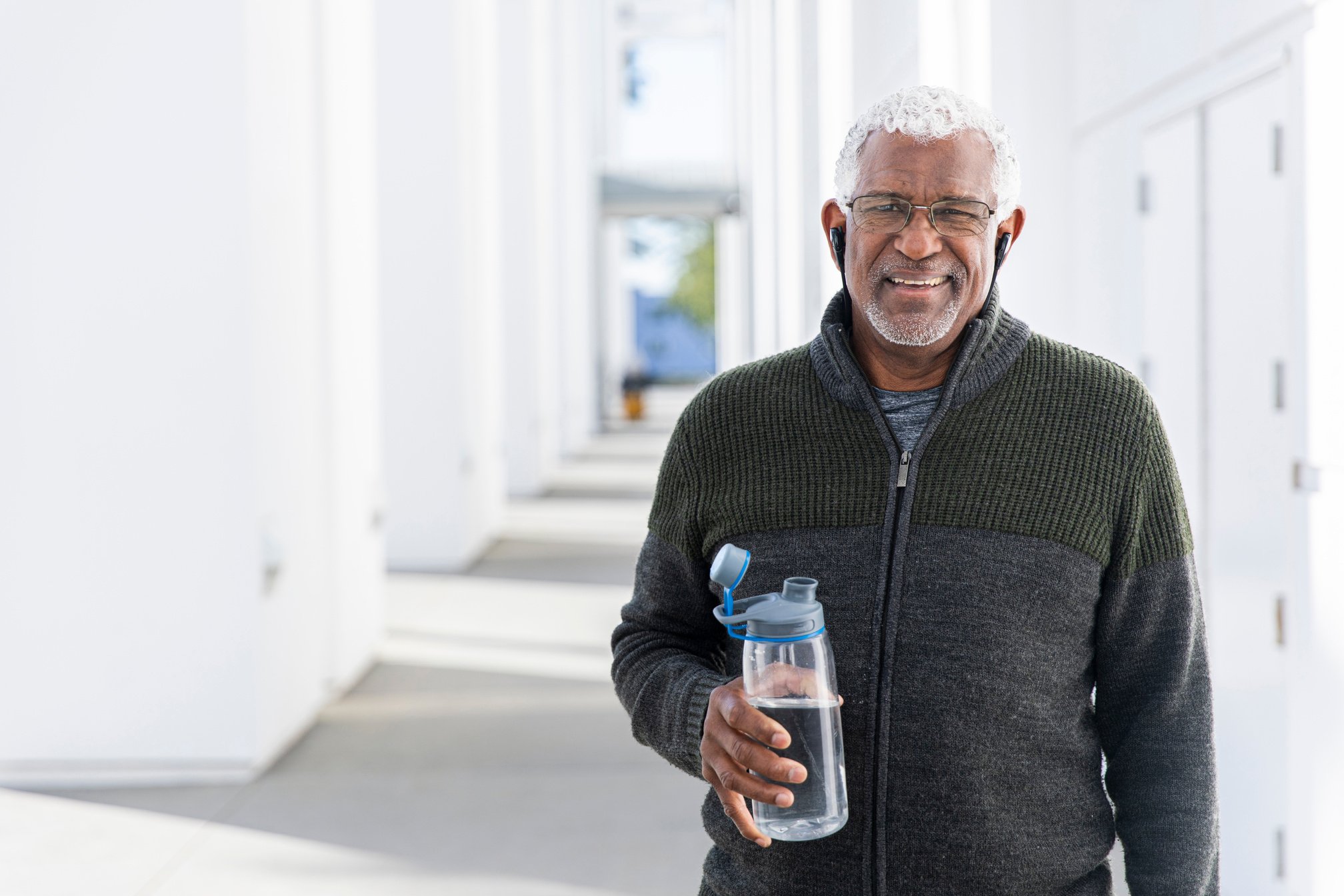 Elderly Man Holding a Water Bottle 